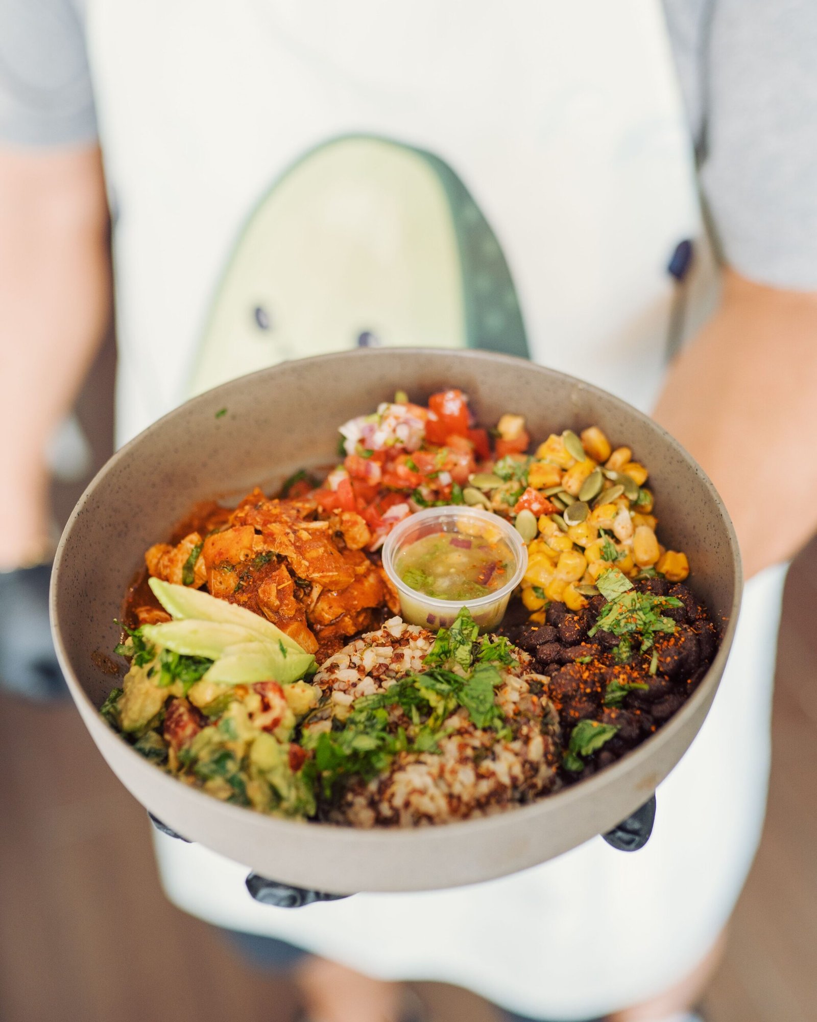 Bowl of Mexican quinoa with black beans, corn, and avocado