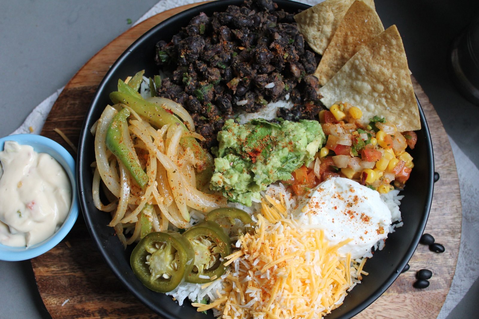 Burrito bowl with rice, black beans, salsa and cheese
