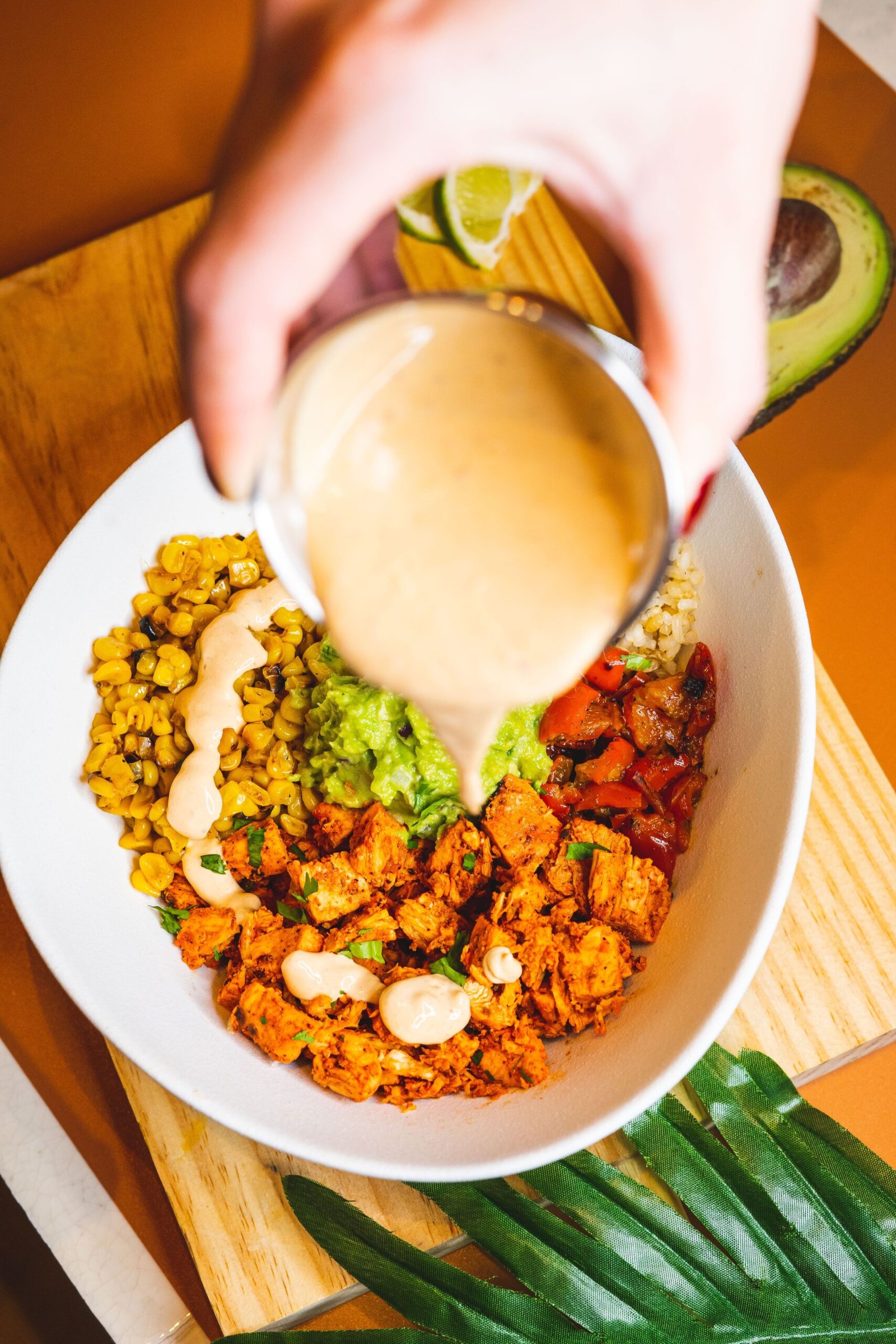 Chicken taco bowl with avocado and sauce