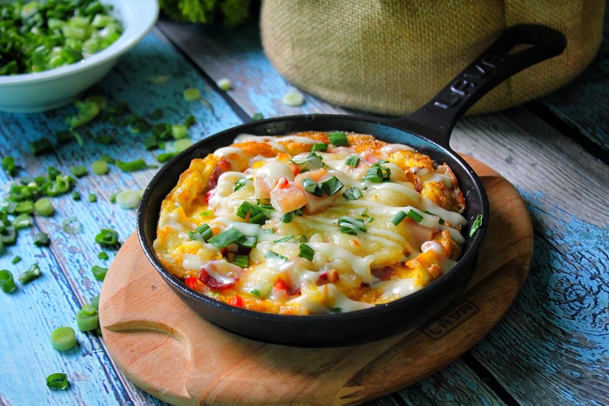 Frittata with herbs in a cast iron skillet