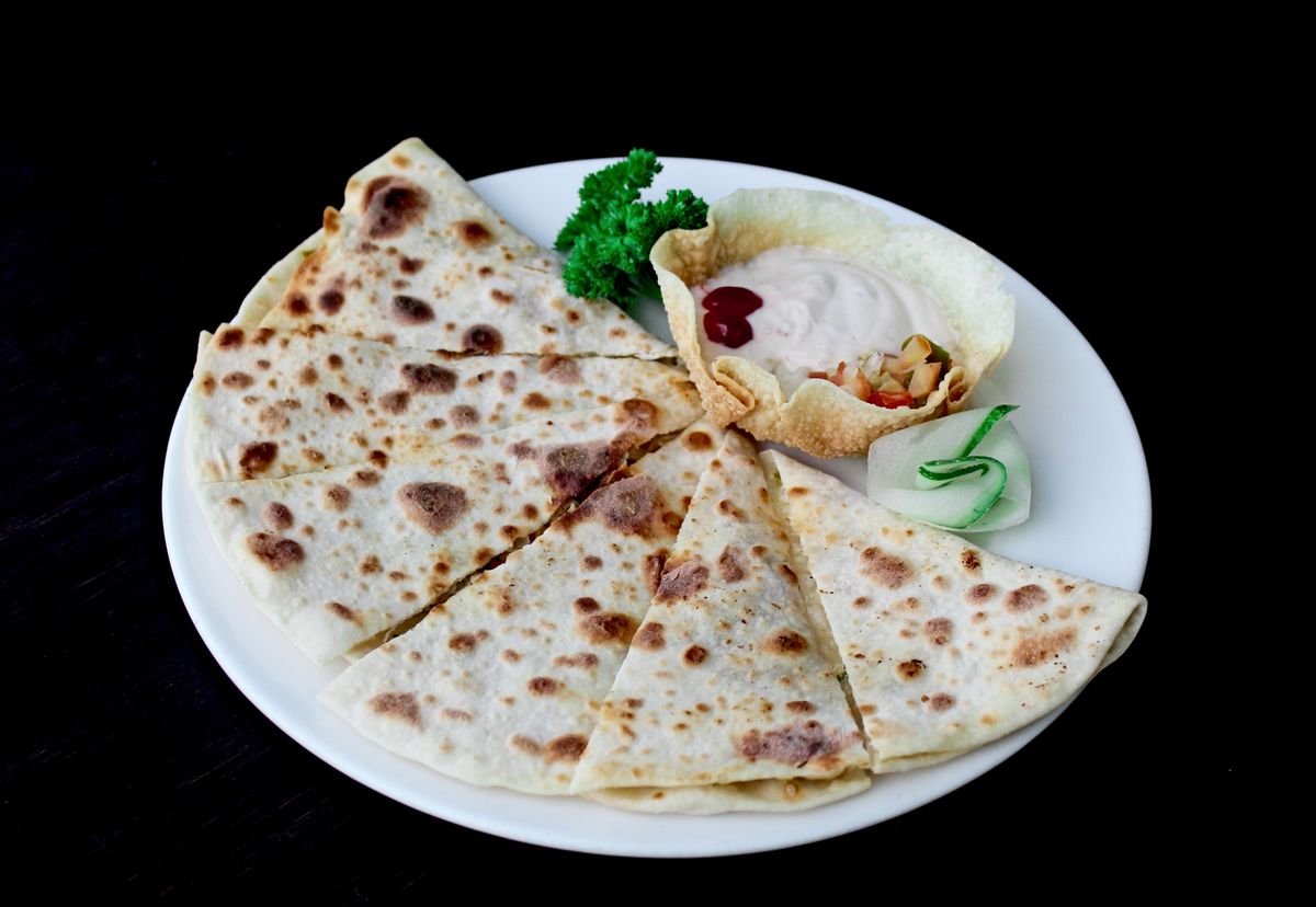 Quesadilla wedges on a white plate